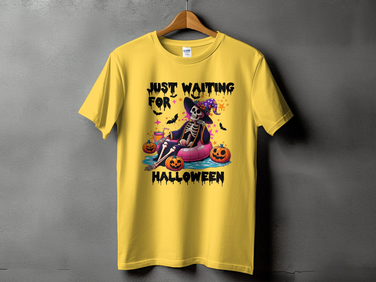 Yellow t-shirt with skeleton graphic saying "Just Waiting For Halloween".