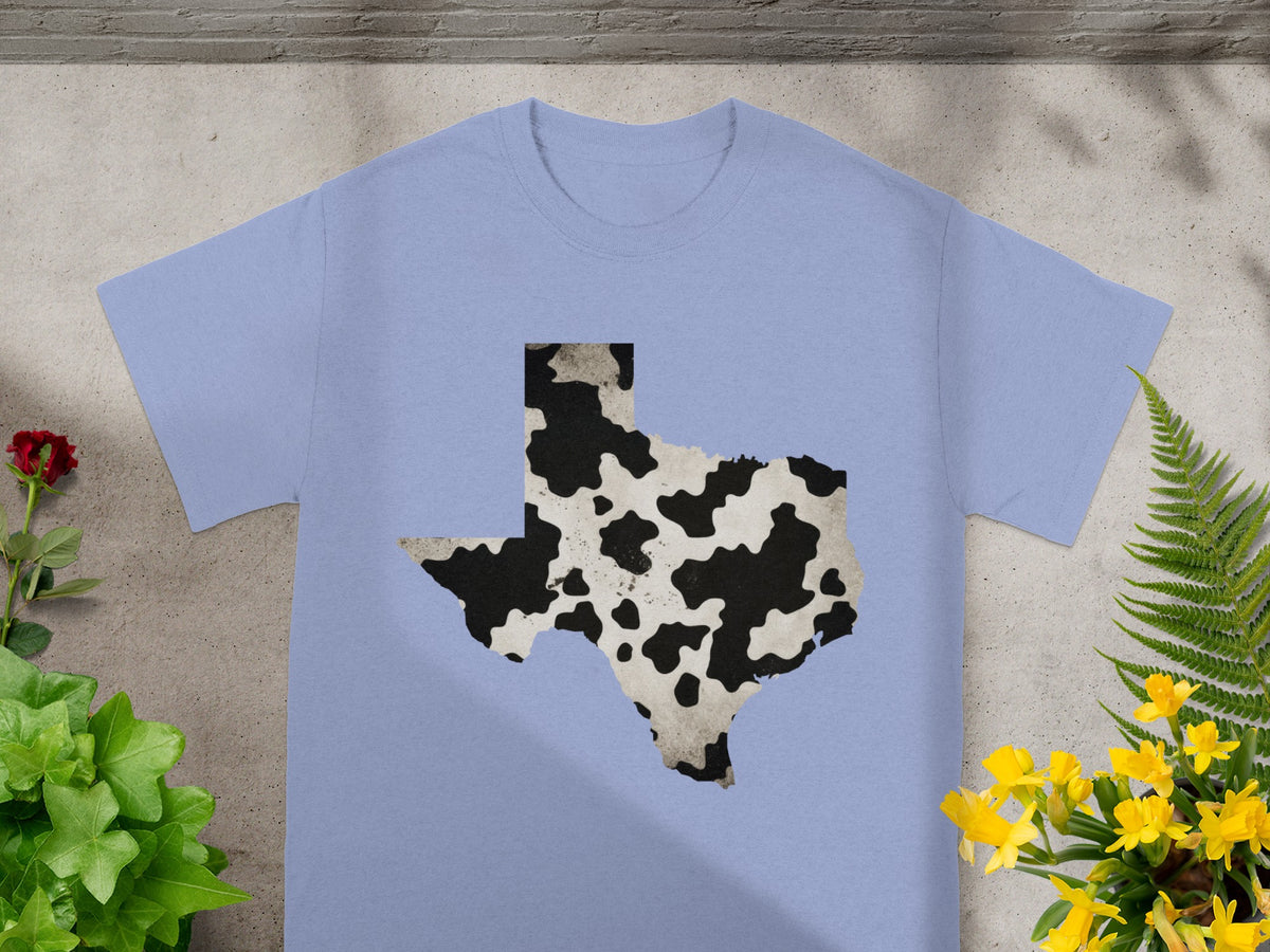 Light blue t-shirt with a black and white cow print Texas outline.
