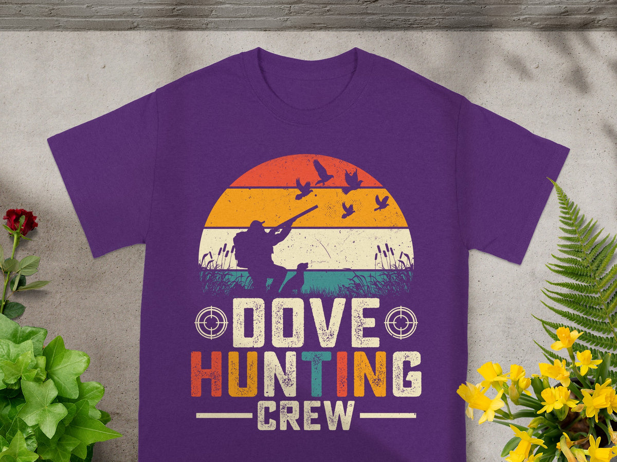 Purple t-shirt graphic with hunter, dog, birds, and "Dove Hunting Crew" text.