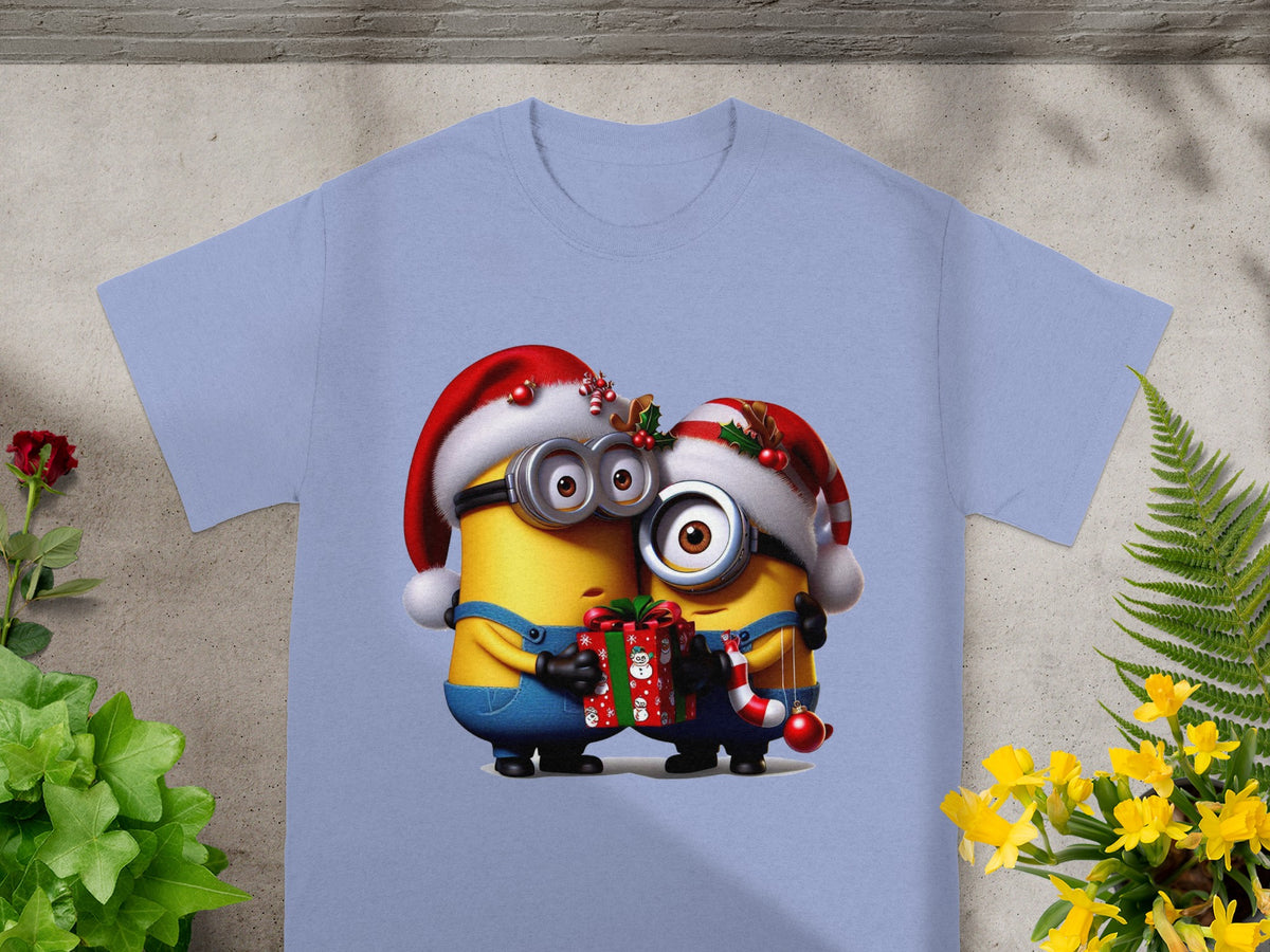 Two Minions in festive Santa hats hold a gift and a candy cane.
