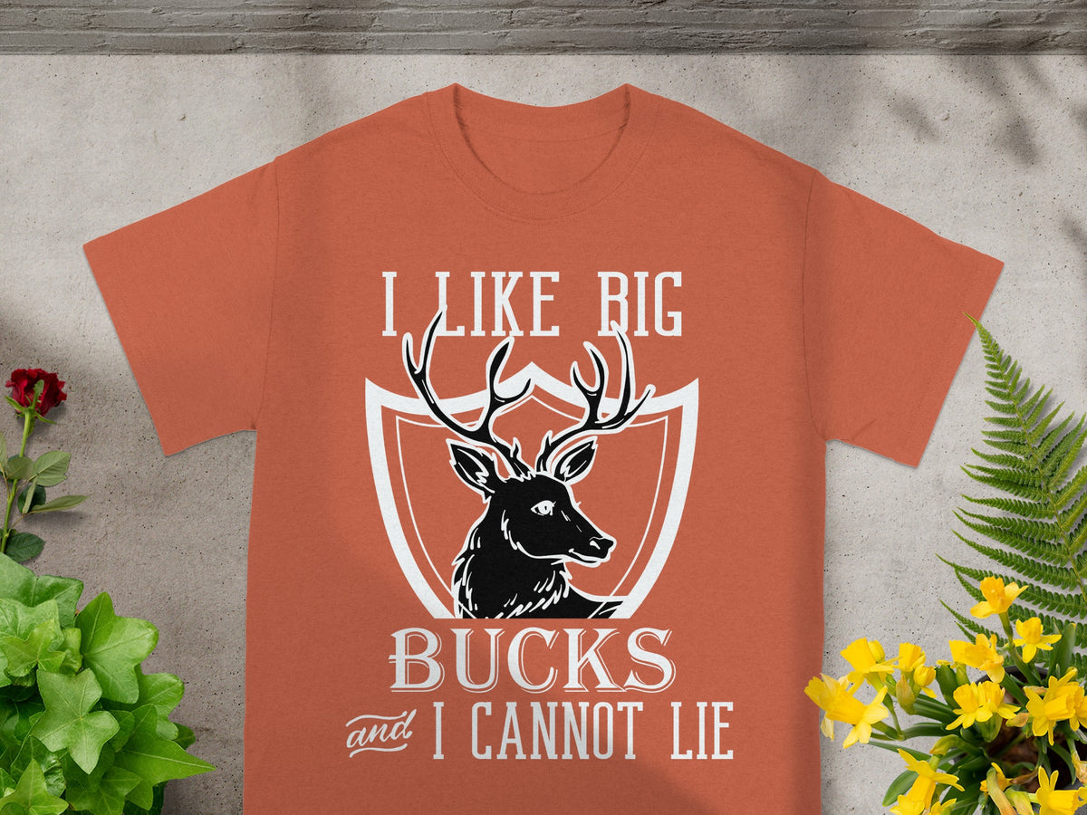 Orange t-shirt with a deer silhouette and "I LIKE BIG BUCKS and I CANNOT LIE" text.