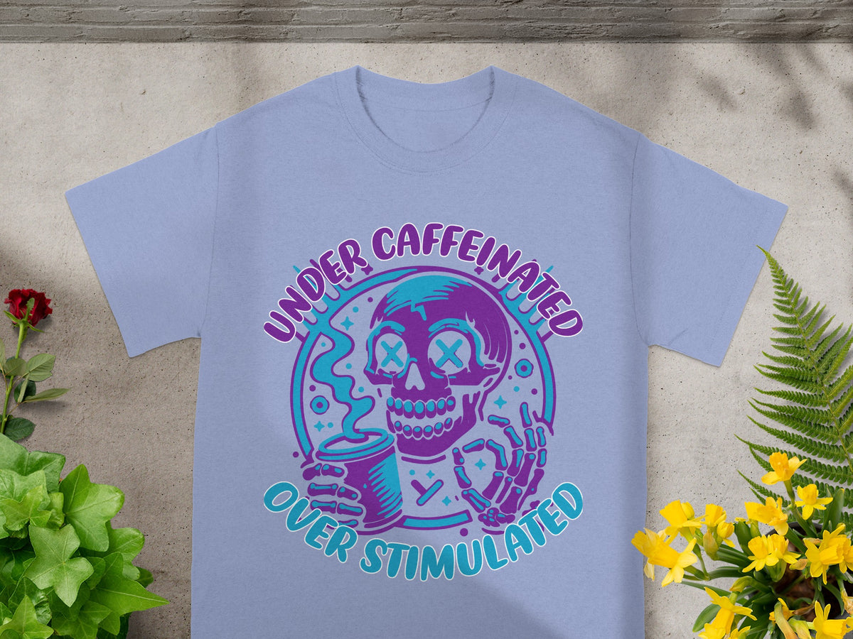 T-shirt with graphic of a skeleton holding a coffee cup, text reads "Under Caffeinated Over Stimulated".