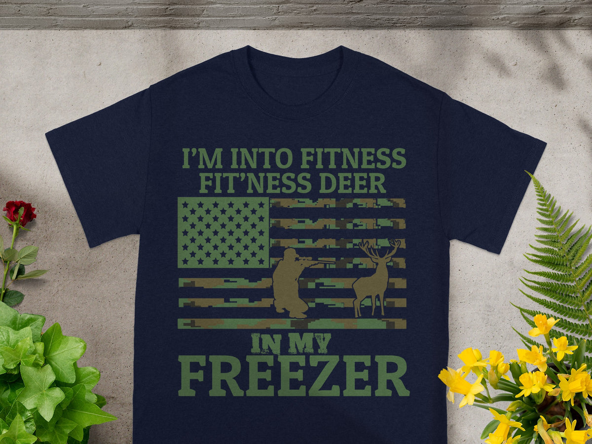 Navy t-shirt with text "I'M INTO FITNESS FIT'NESS DEER IN MY FREEZER" and a camouflage flag.