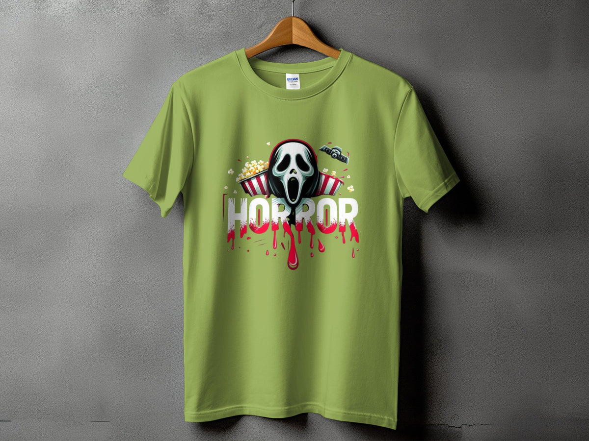 Green t-shirt with horror movie mask, popcorn, and dripping red text.