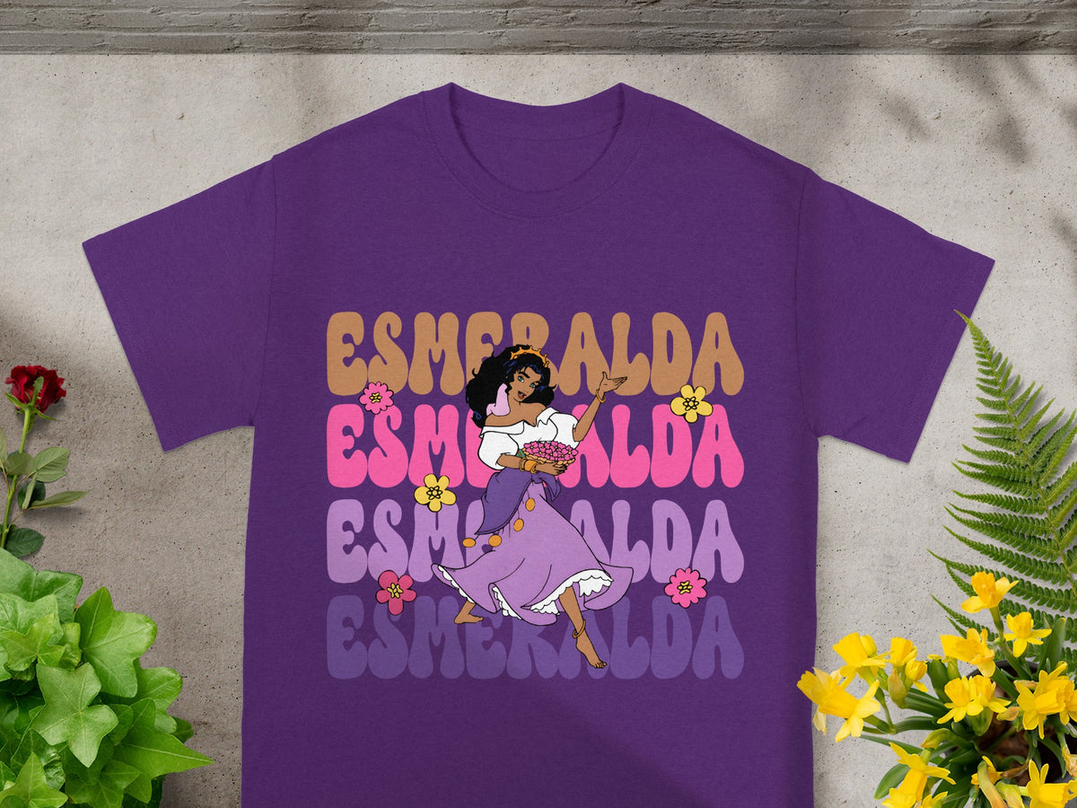 Esmeralda dancing in a purple shirt with colorful text.