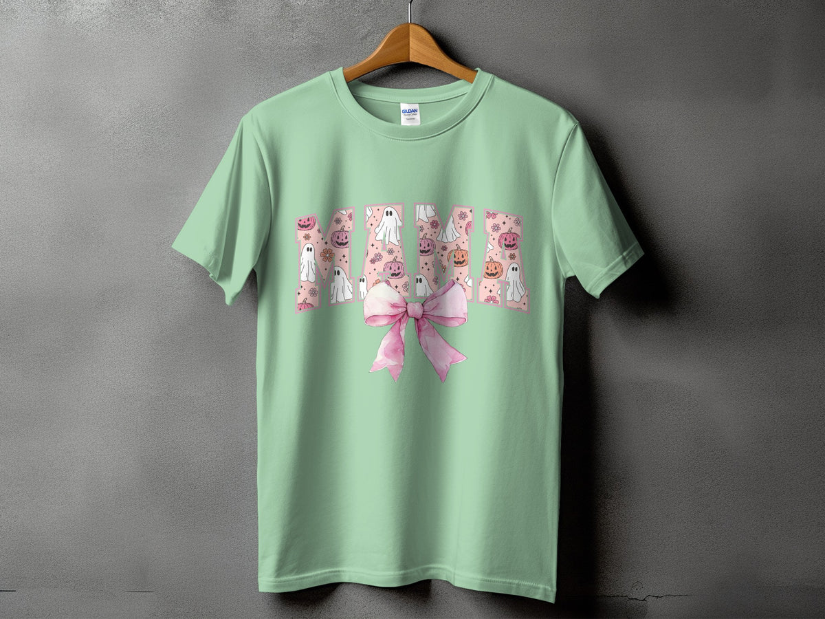 Mint green t-shirt with "Mama" text and Halloween ghosts, pumpkins, and flowers.