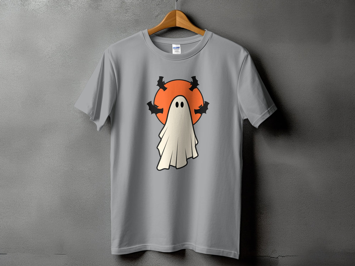 Grey t-shirt with a cartoon ghost and bats on an orange circle.