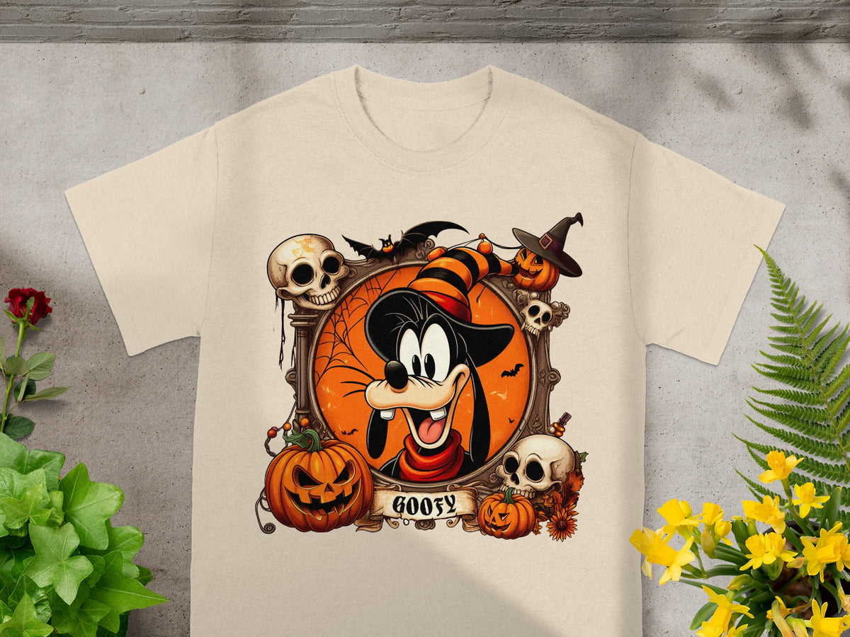 Goofy Halloween graphic on a light tan t-shirt with pumpkins, skulls, and bats.