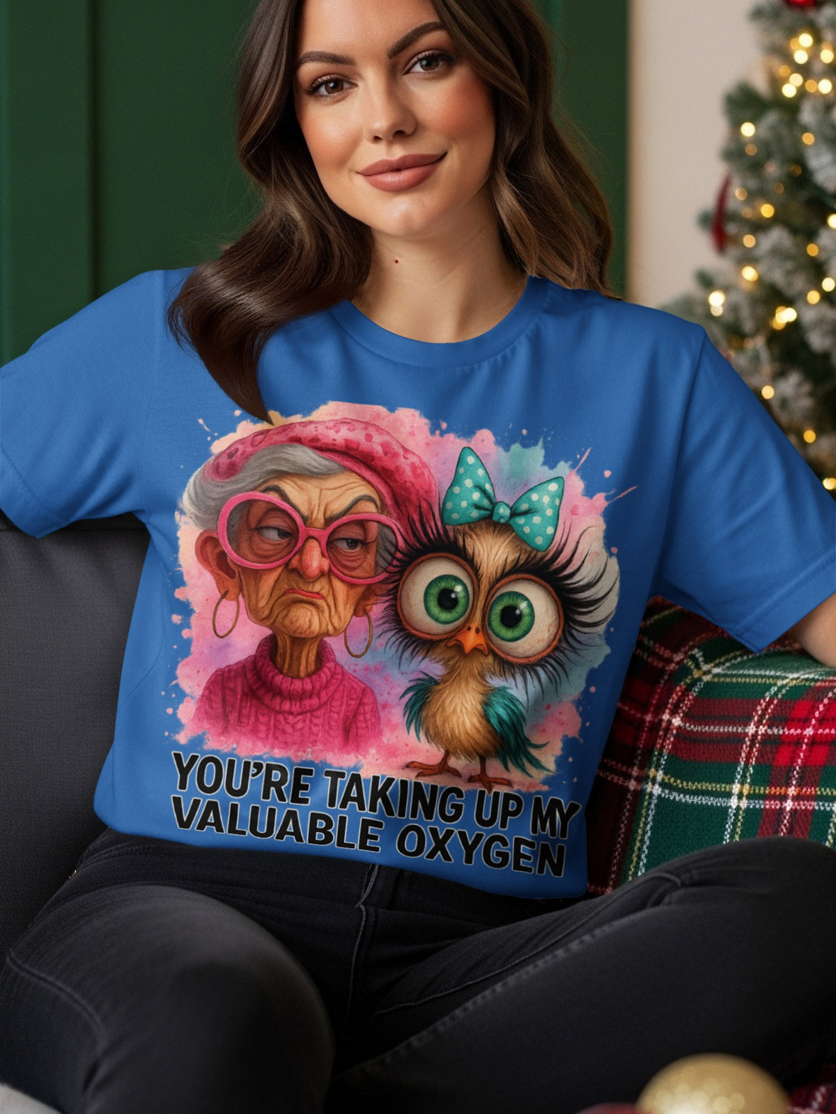 Cartoon owl and elderly woman graphic on a blue t-shirt.