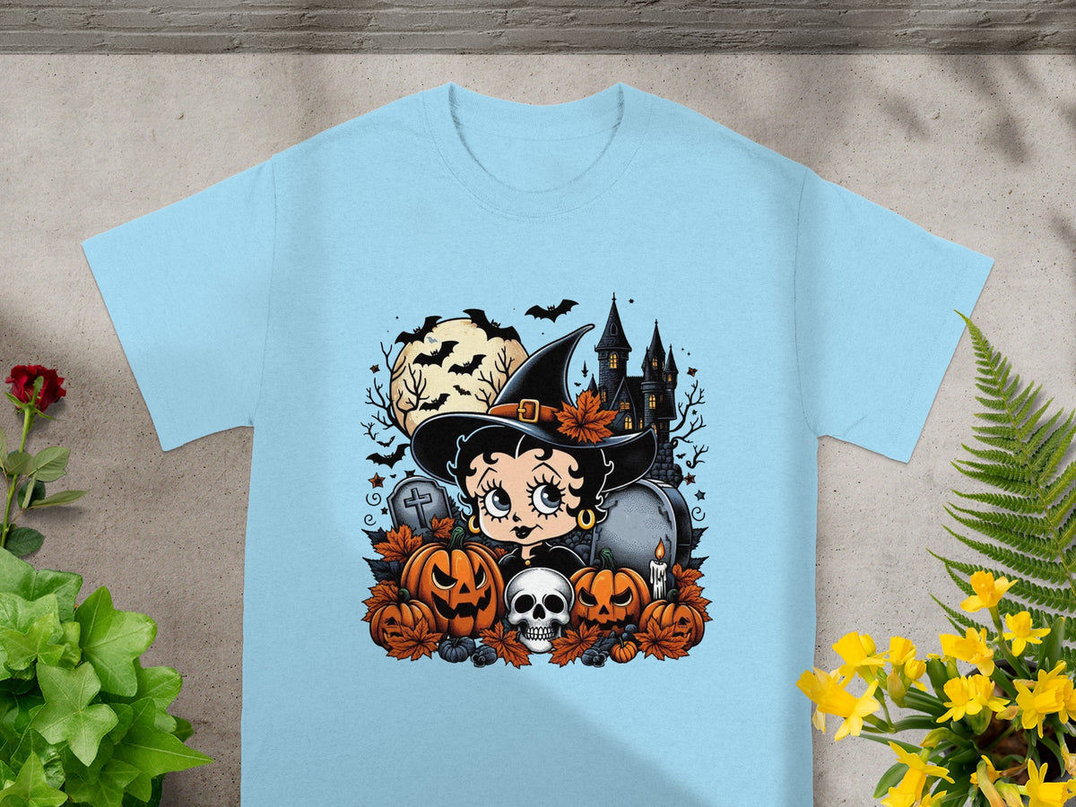 Betty Boop as a witch with pumpkins, skull, and haunted castle on a light blue t-shirt.