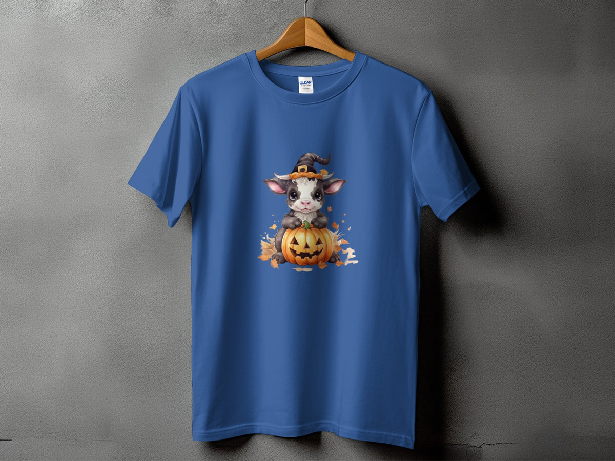 Blue t-shirt with a cute cow wearing a witch hat on a jack-o'-lantern.