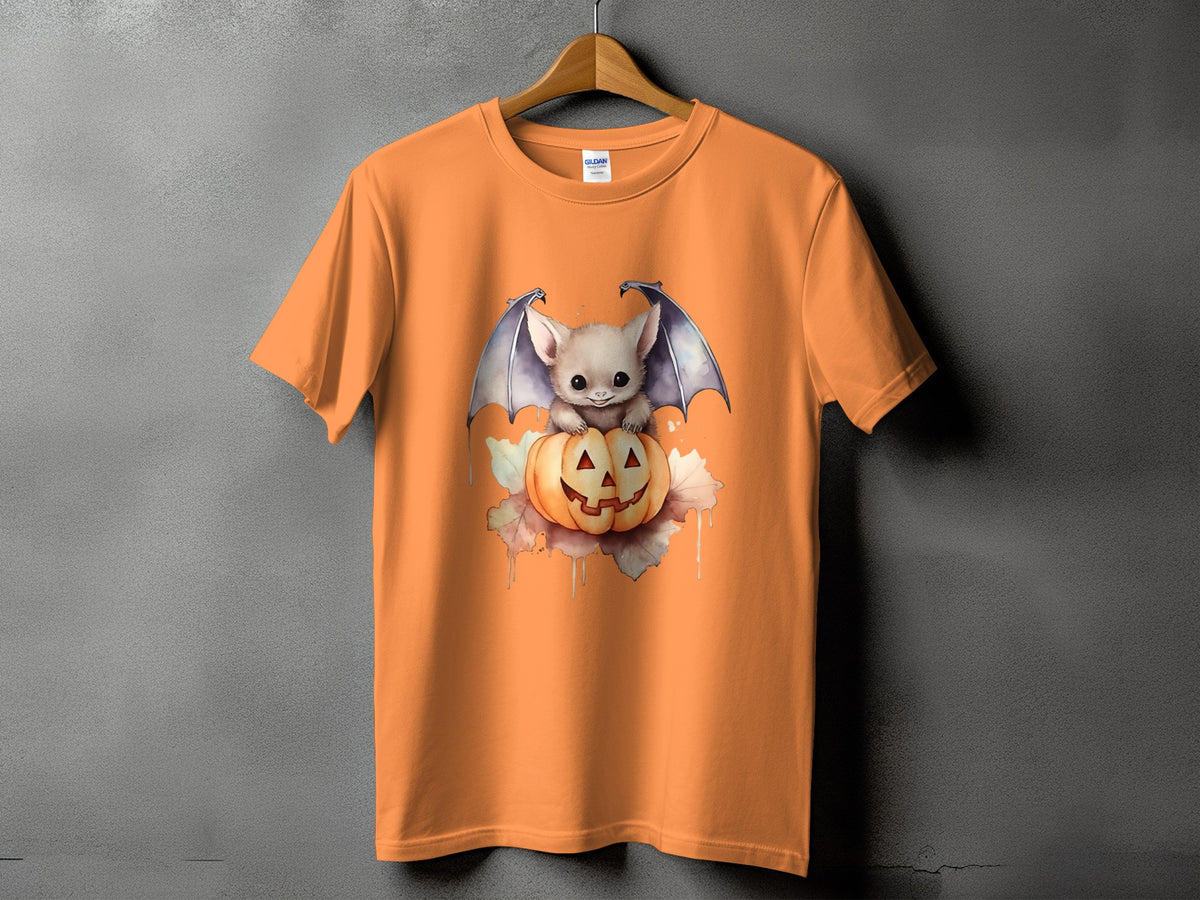 Orange t-shirt with a cute bat and jack-o'-lantern Halloween graphic.