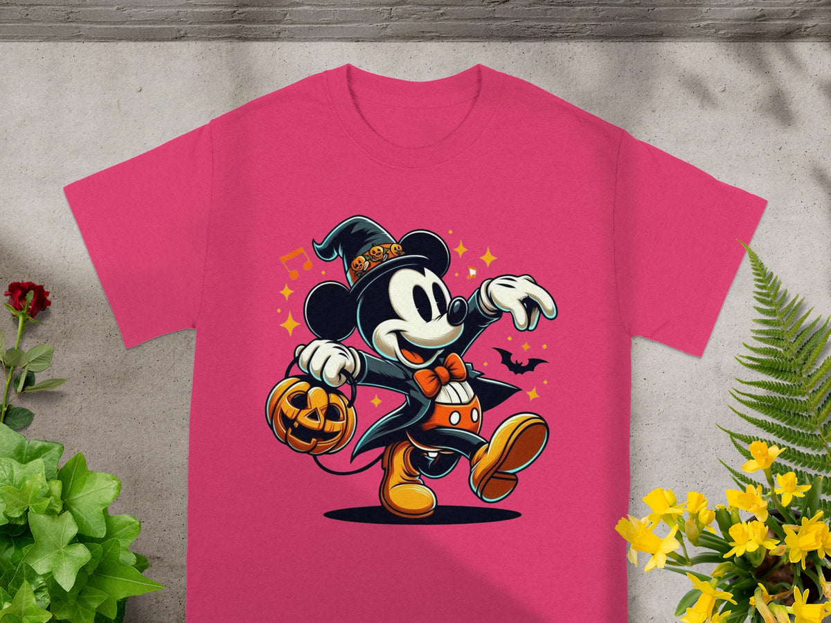 Mickey Mouse in a witch hat holding a pumpkin on a pink t-shirt.