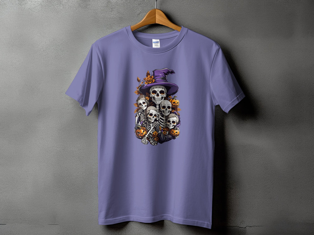 Purple t-shirt with a Halloween graphic featuring skeletons, witch hat, and pumpkins.