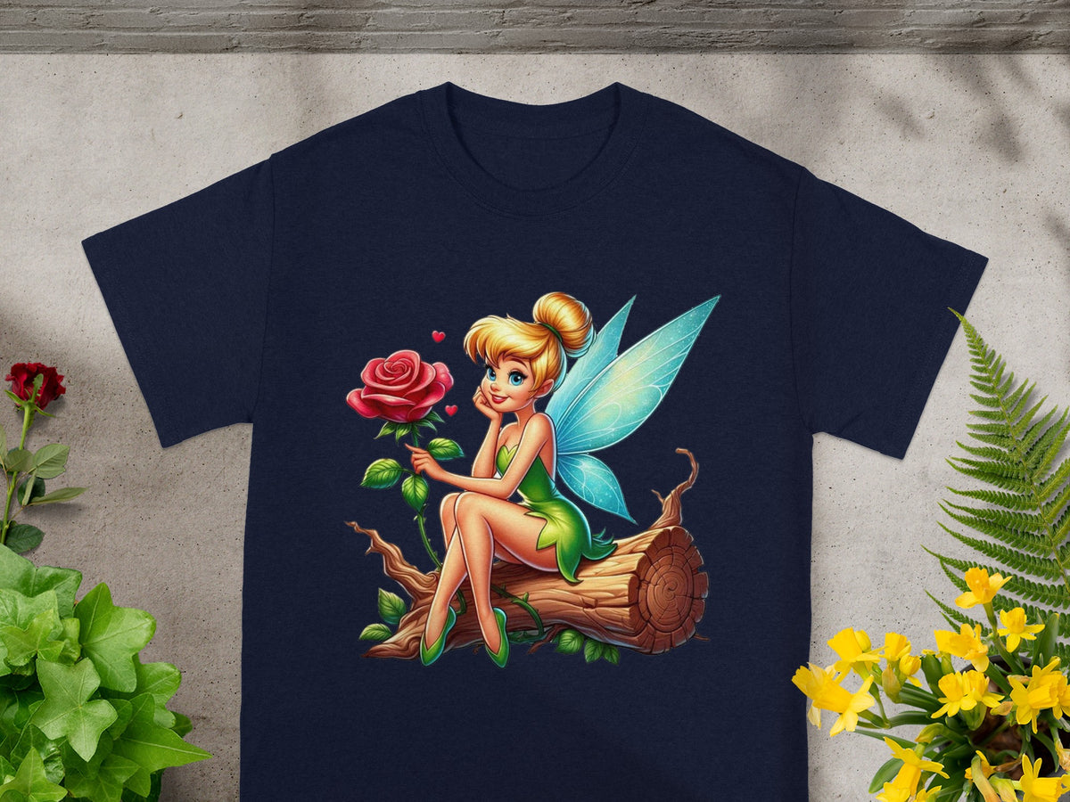 Tinkerbell sits on a log holding a rose.