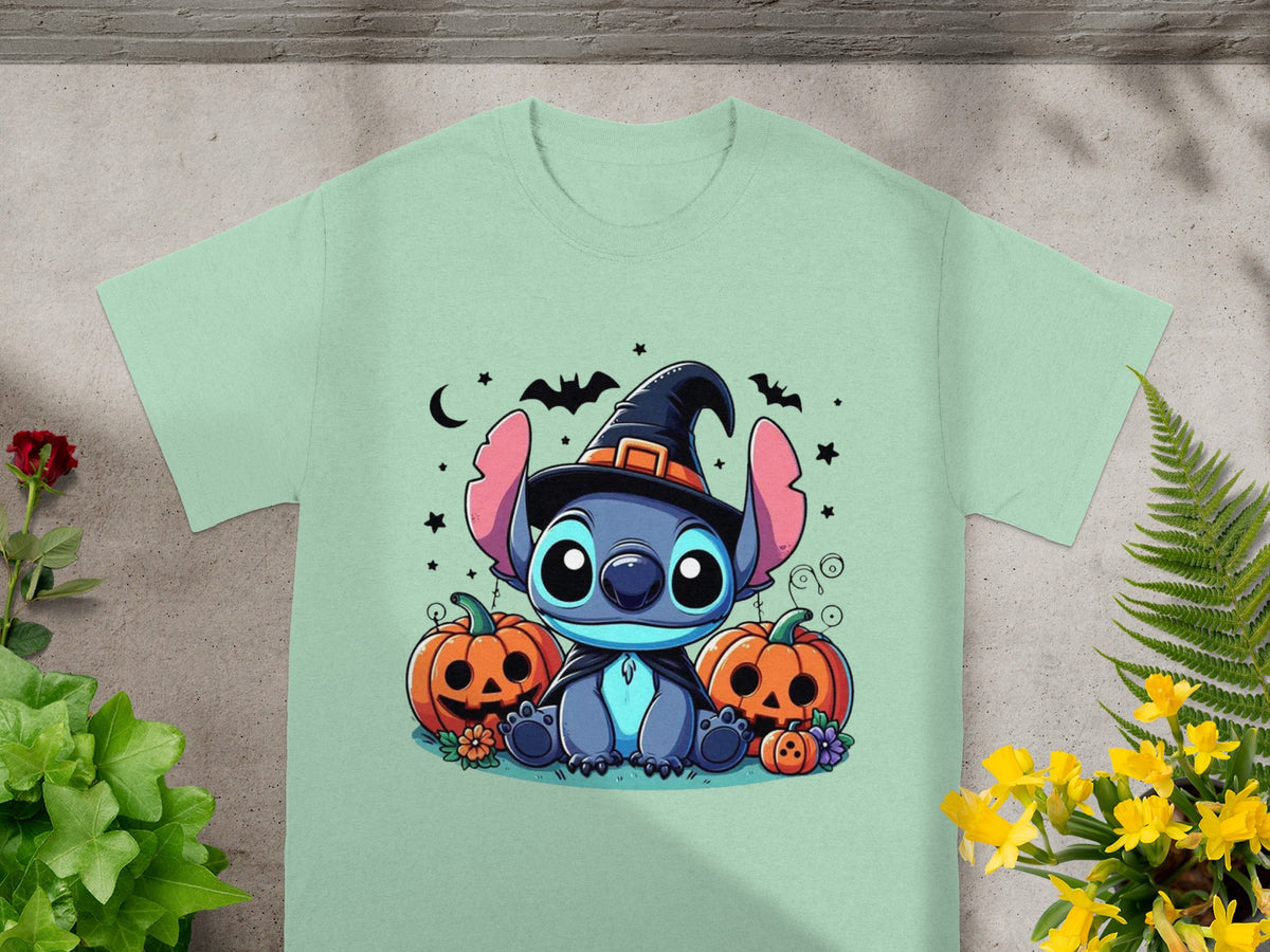 Stitch in a witch hat sits between pumpkins under a moon and bats.
