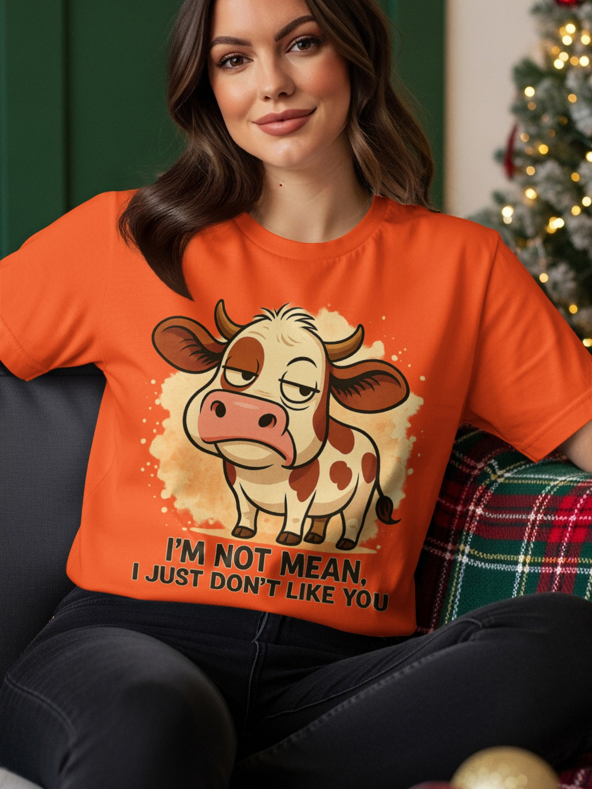 Orange t-shirt with cartoon cow saying "I'm not mean, I just don't like you."