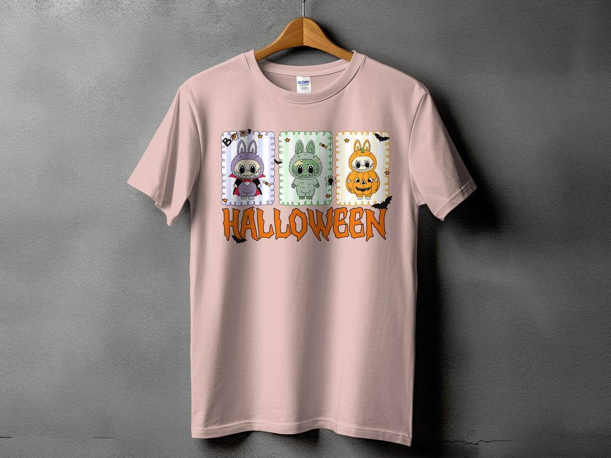 Pink t-shirt with three Halloween-themed cartoon characters and "HALLOWEEN" text.