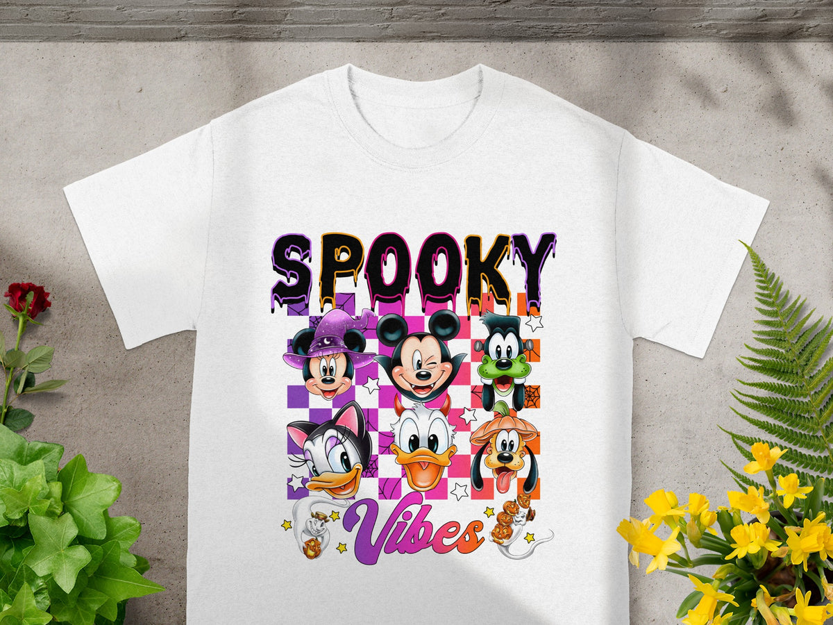 White t-shirt with "SPOOKY Vibes" text and Disney characters in Halloween costumes.