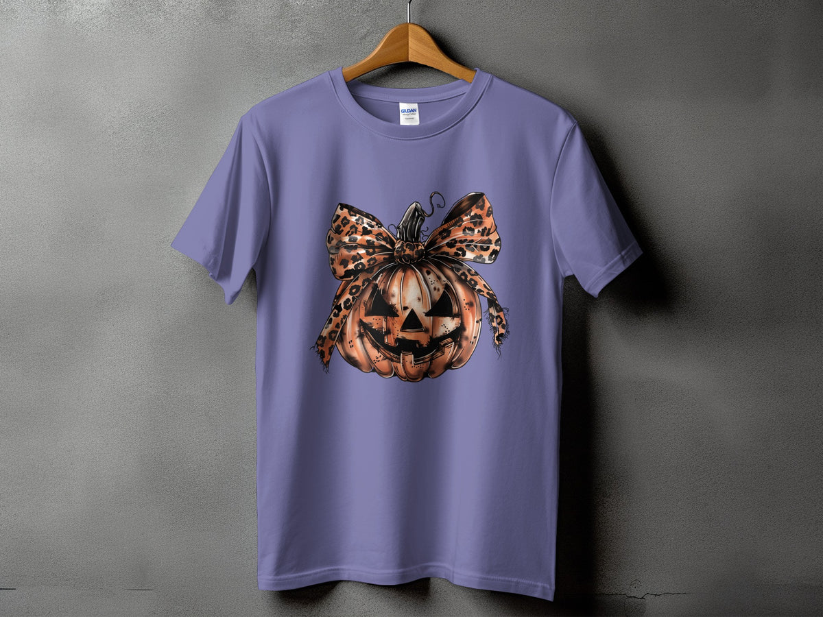 Purple t-shirt with a distressed jack-o'-lantern and leopard print bow graphic.