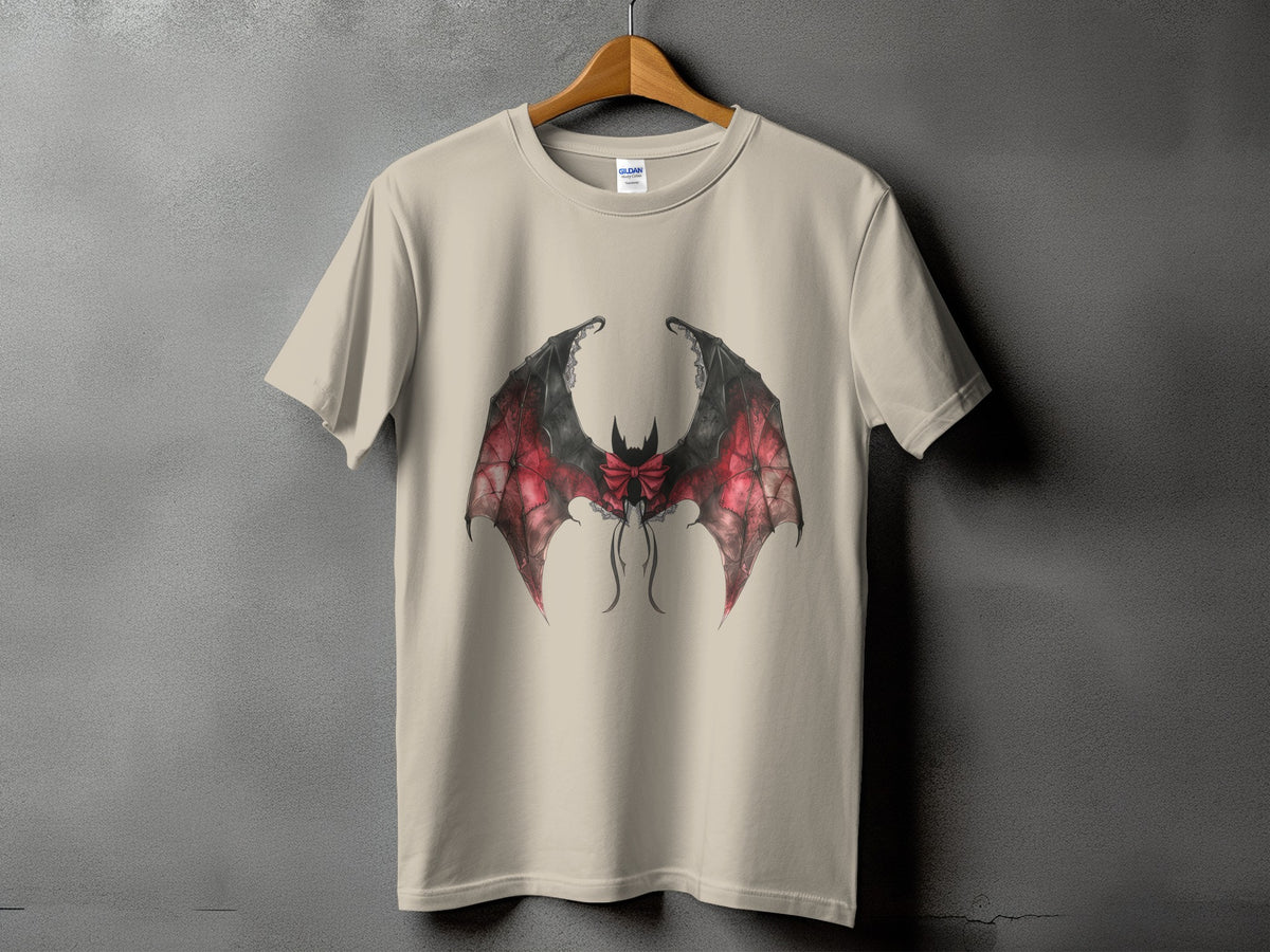 Beige t-shirt with a red and black bat wing design and a bow.