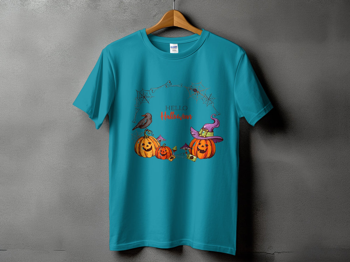 Teal t-shirt with Halloween pumpkins, a witch hat, a bird, and spiders.