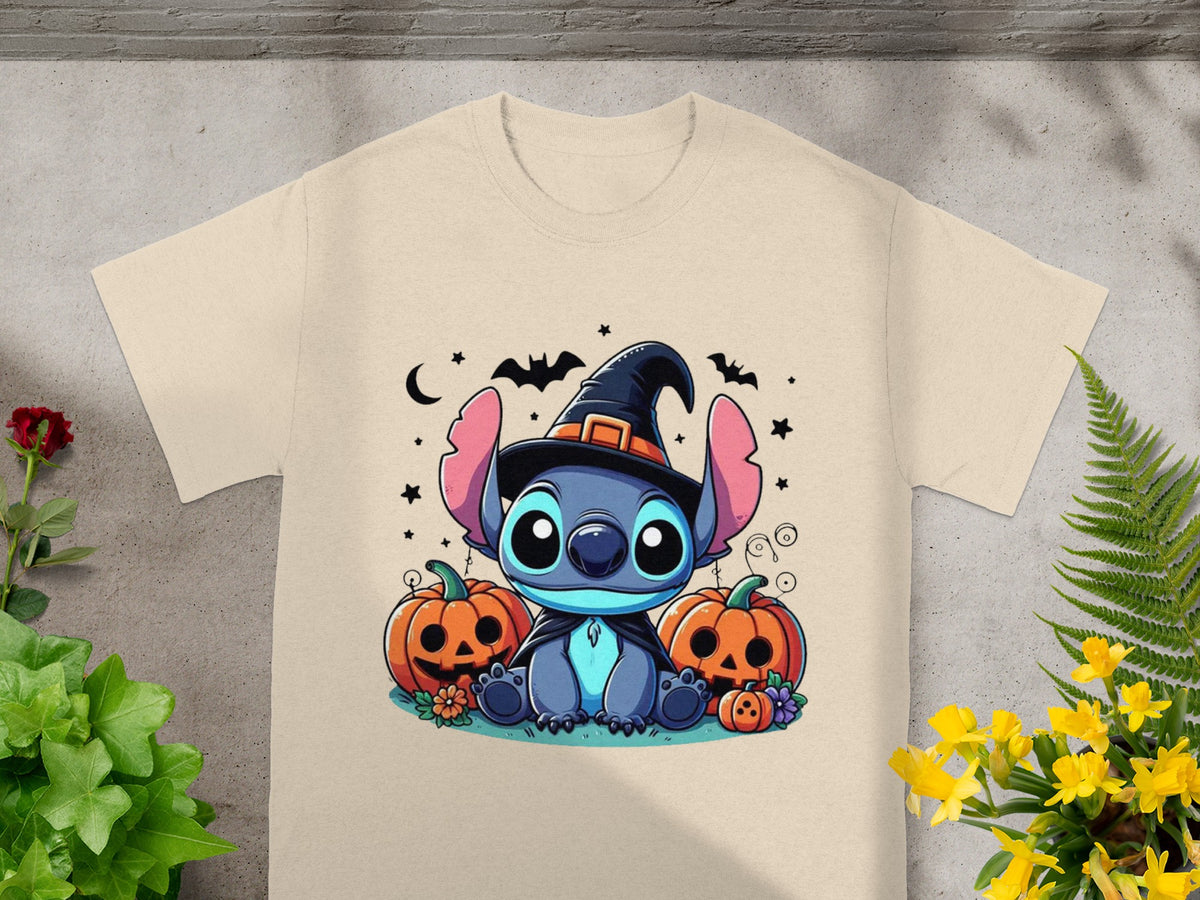 Stitch in witch hat with pumpkins and bats on a light tan t-shirt.