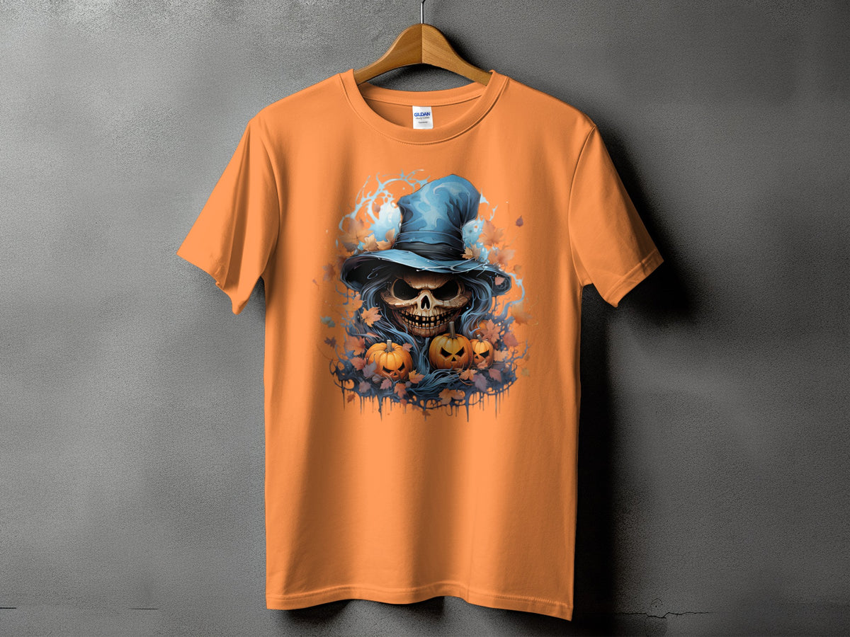 Orange t-shirt with a skull wearing a witch hat and pumpkins graphic.