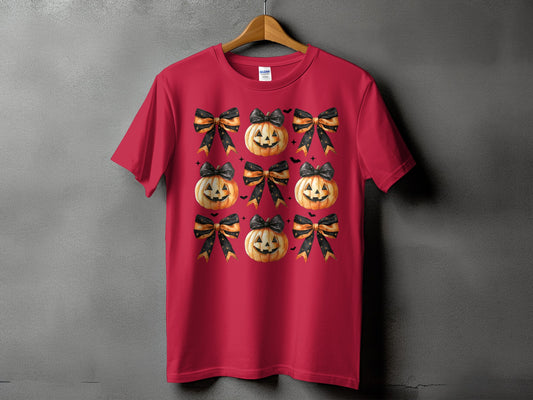 Red t-shirt with a repeating pattern of jack-o'-lanterns and black and orange bows.