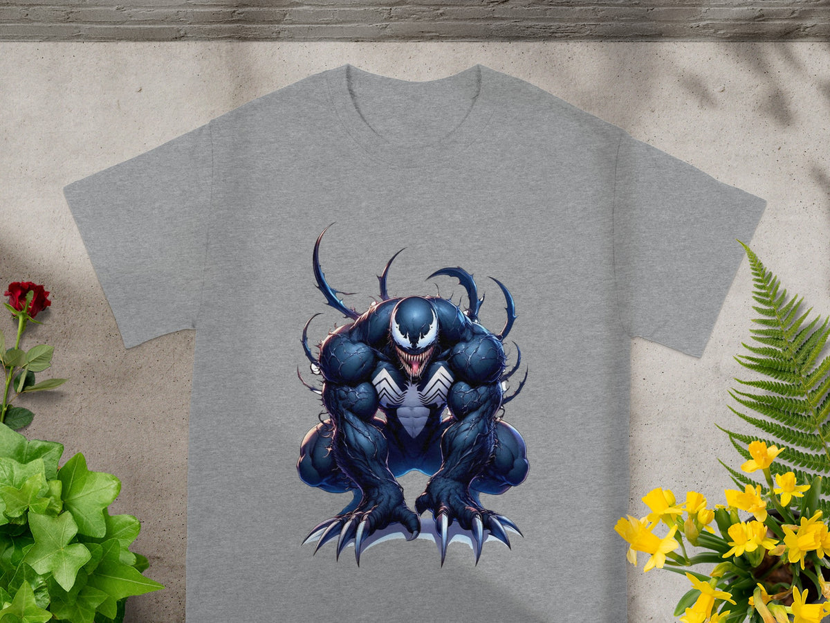 Venom character illustration on a grey t-shirt, partially obscured by plants.