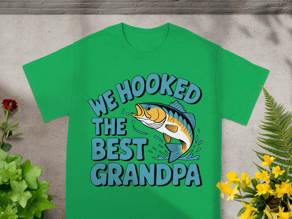 Green t-shirt with "We hooked the best Grandpa" text and a jumping fish design.