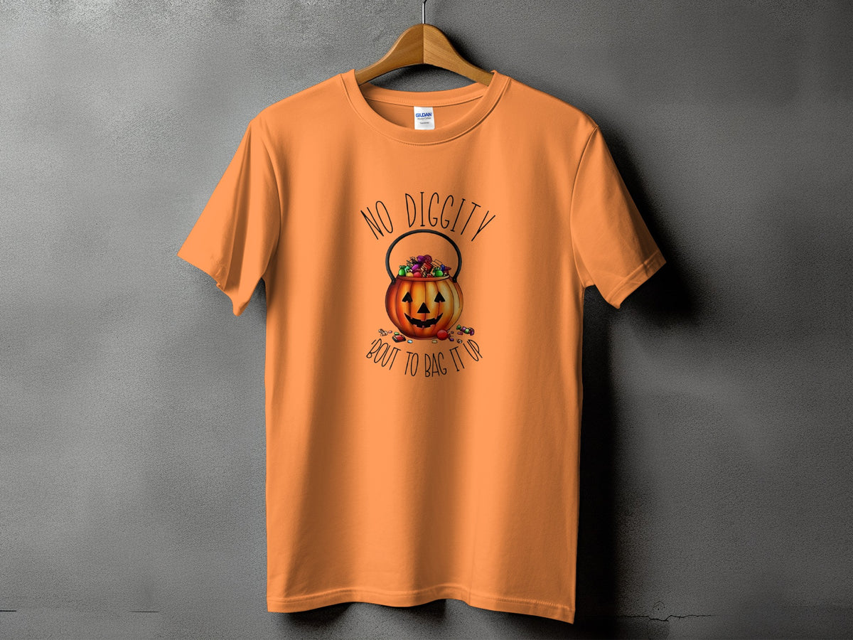 Orange t-shirt with a jack-o'-lantern candy bucket graphic and text.