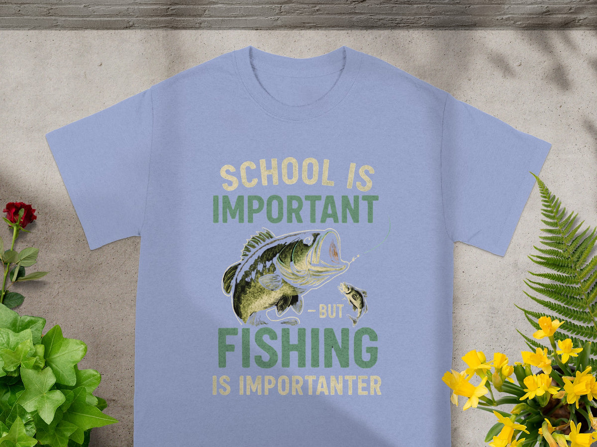 Light blue t-shirt with graphic of bass fishing and text "School is important but fishing is importanter".