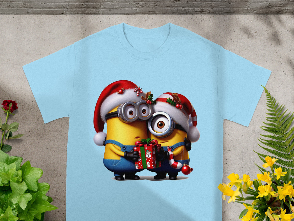 Two Minions in Santa hats hug a gift and Christmas ornament.