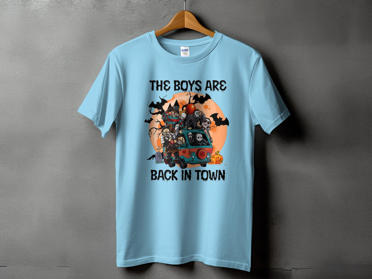 Light blue t-shirt with horror characters in a van graphic and text "THE BOYS ARE BACK IN TOWN".