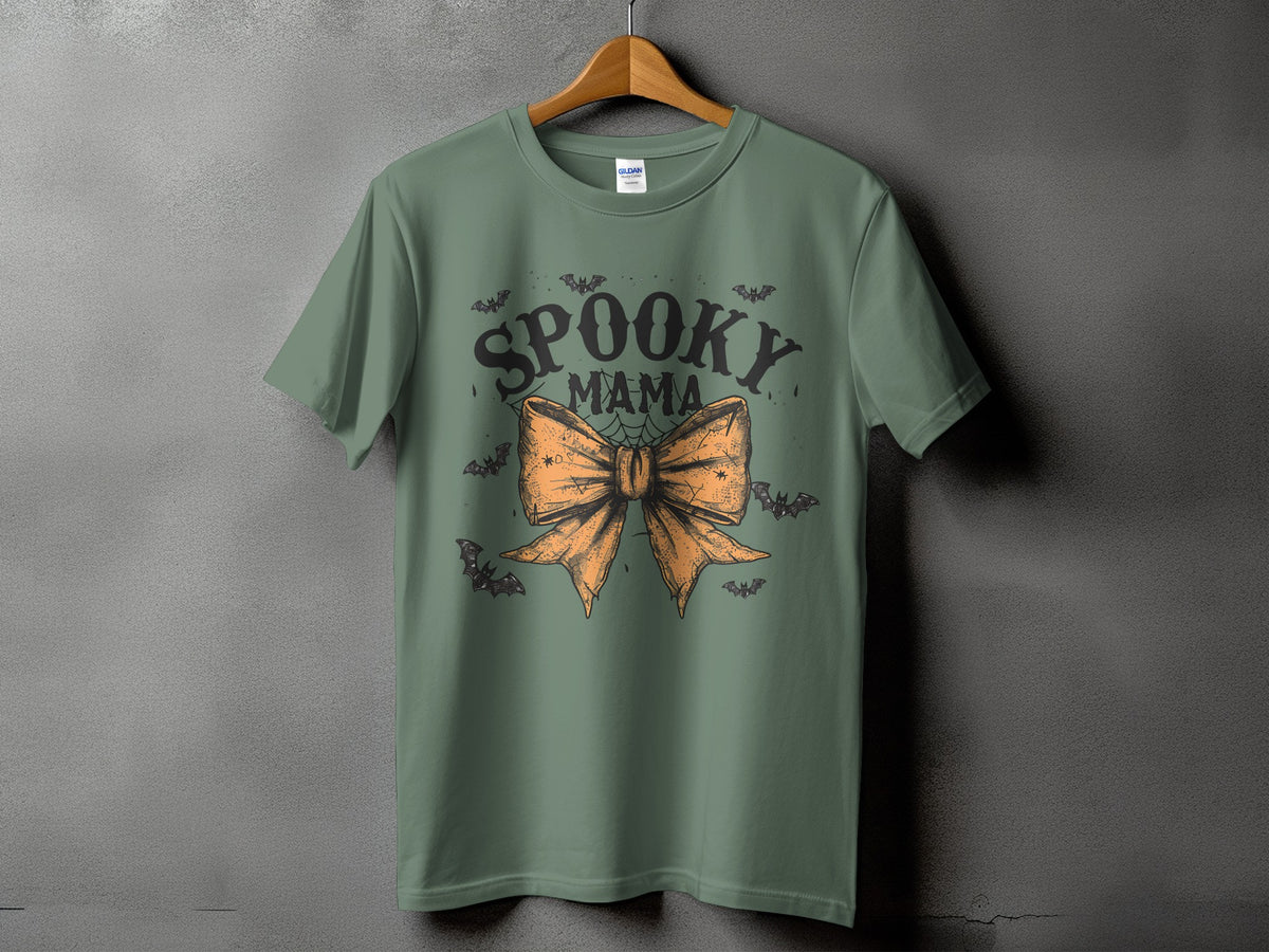 Green t-shirt with "Spooky Mama" text and orange bow graphic with bats.