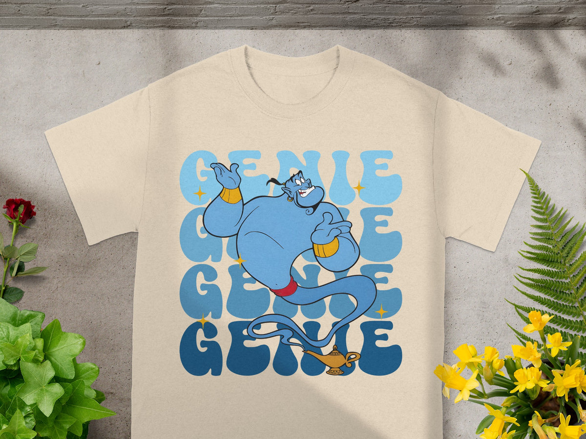 Light tan t-shirt with a blue genie from Aladdin in a retro-style, repeating text graphic.