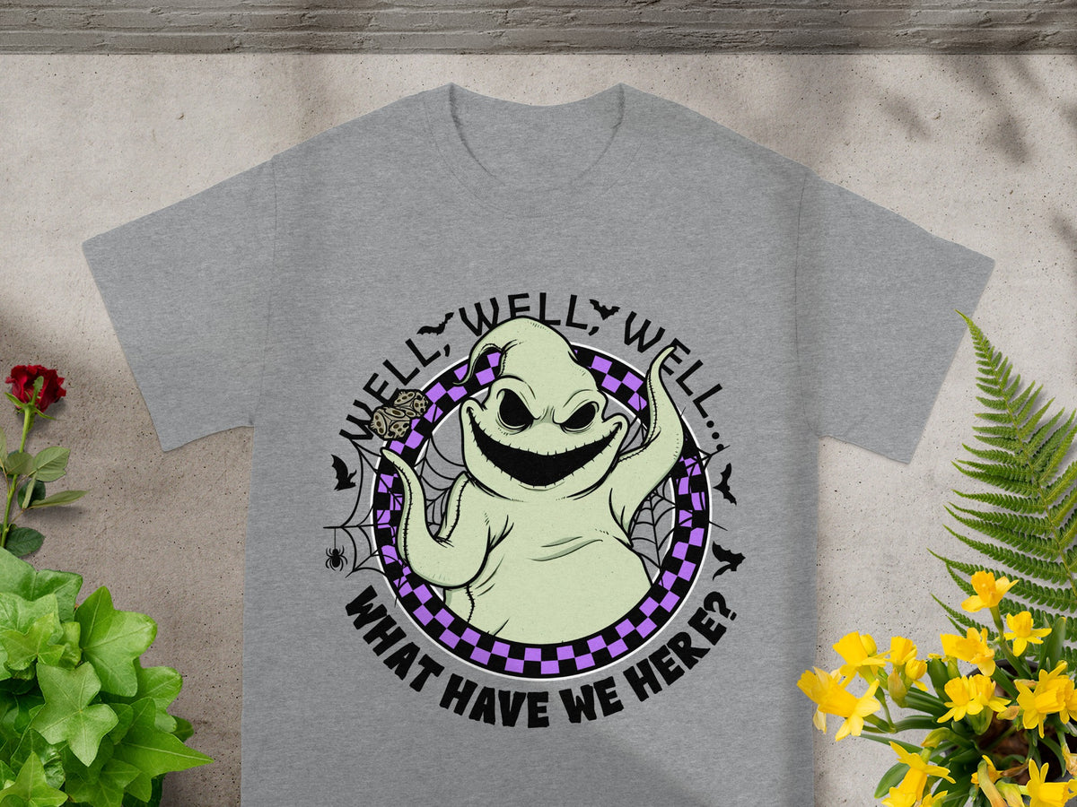 Grey t-shirt with a cartoon ghost on it saying "Well, well, well... What have we here?".