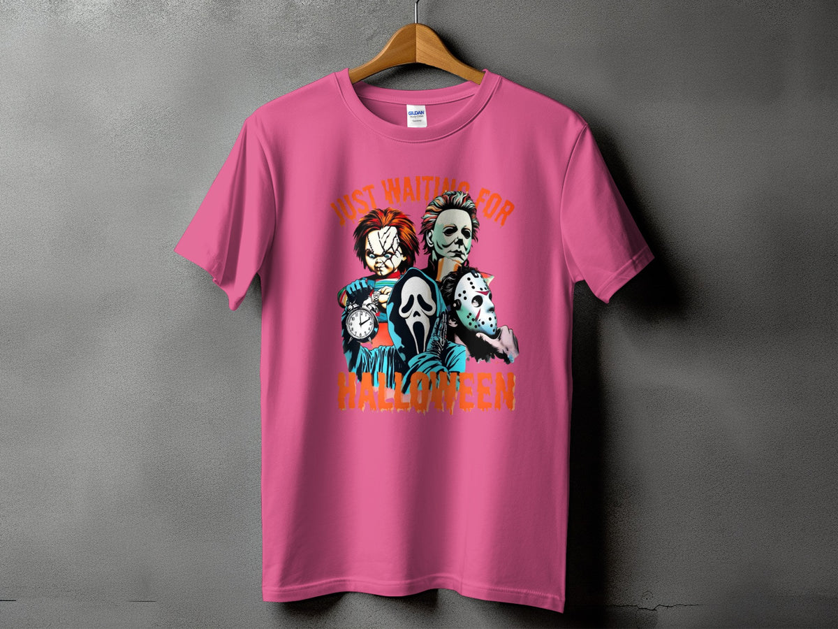 Pink t-shirt featuring Chucky, Michael Myers, and Ghostface with "Just Waiting for Halloween" text.