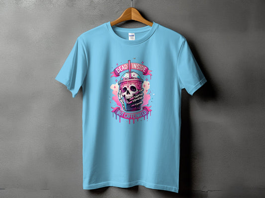 Light blue t-shirt with a skull holding a drink, reading "Dead Inside But Caffeinated".