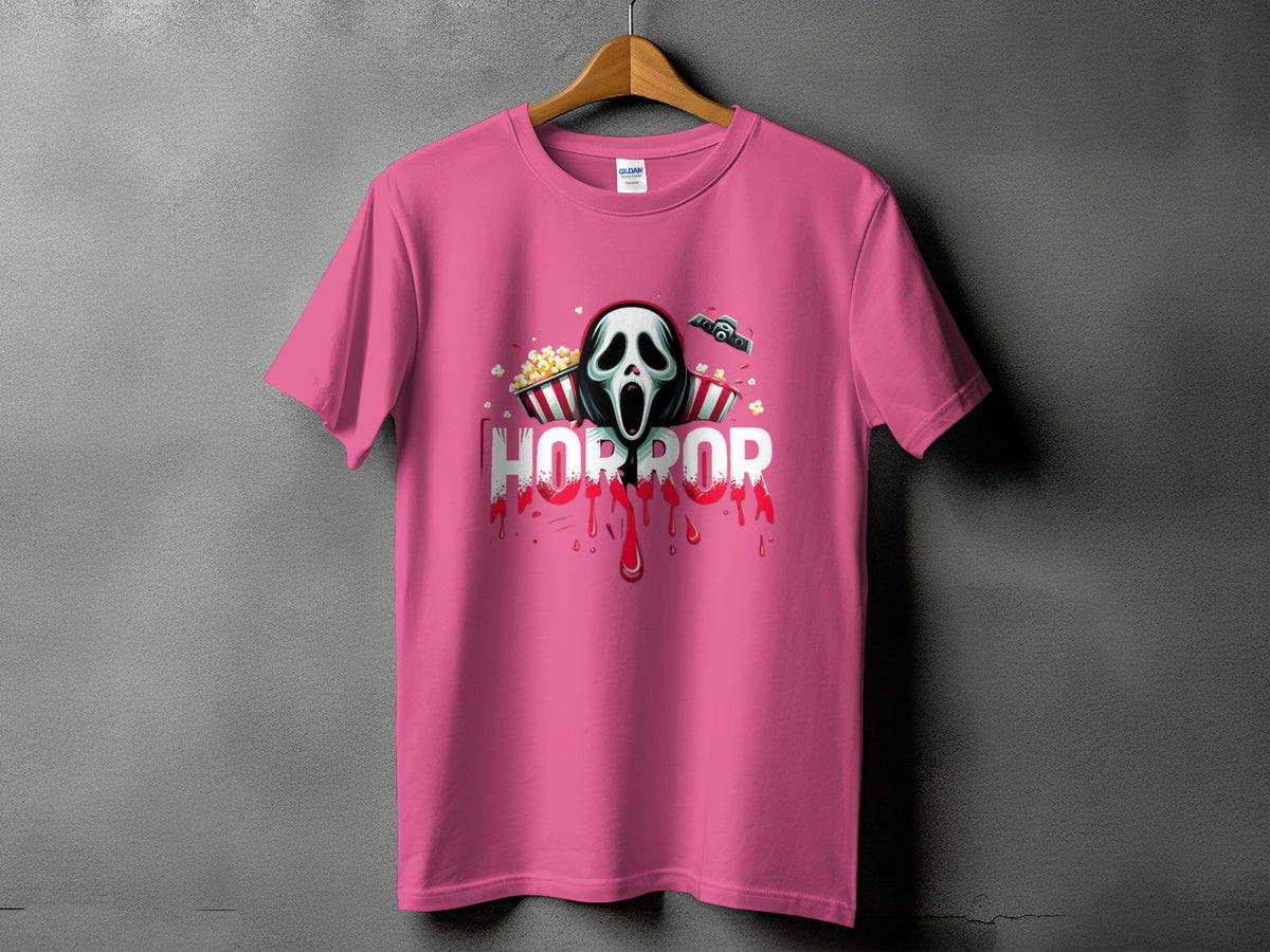 Pink t-shirt with a horror mask, popcorn buckets, and the word HORROR.
