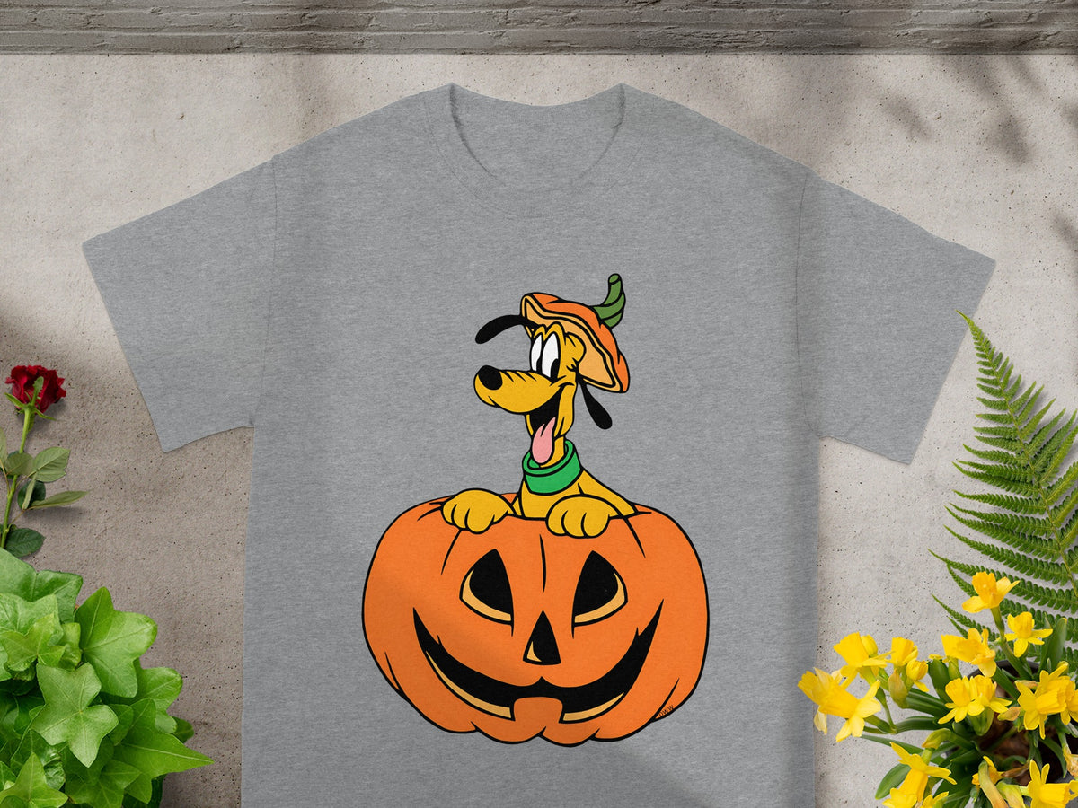 Pluto dog wearing pumpkin hat peeking out of jack-o'-lantern on grey t-shirt.