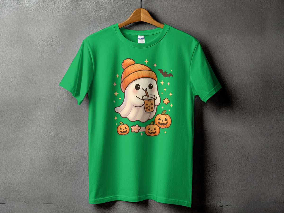 Green t-shirt with cute ghost in orange hat holding bubble tea, surrounded by pumpkins.
