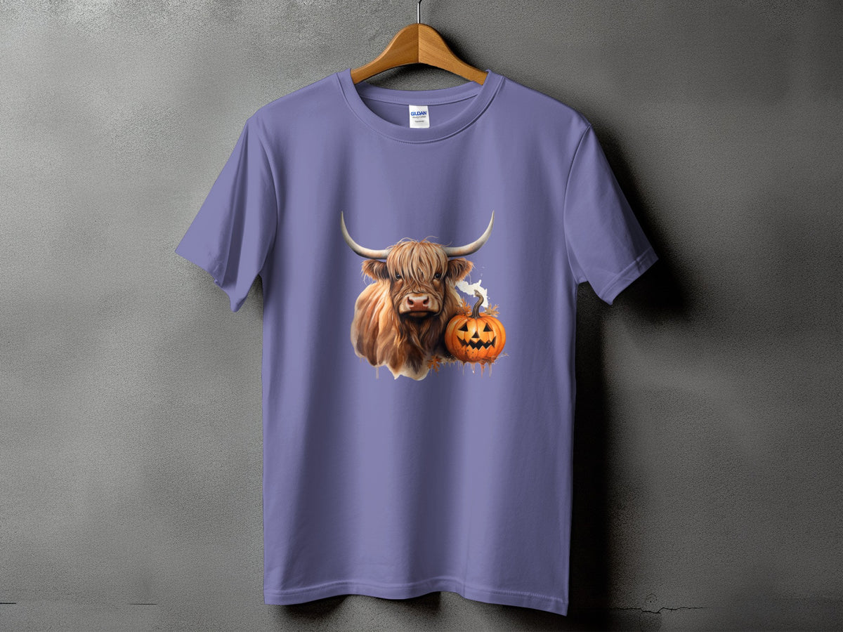Highland cow and jack-o'-lantern graphic on a purple t-shirt.