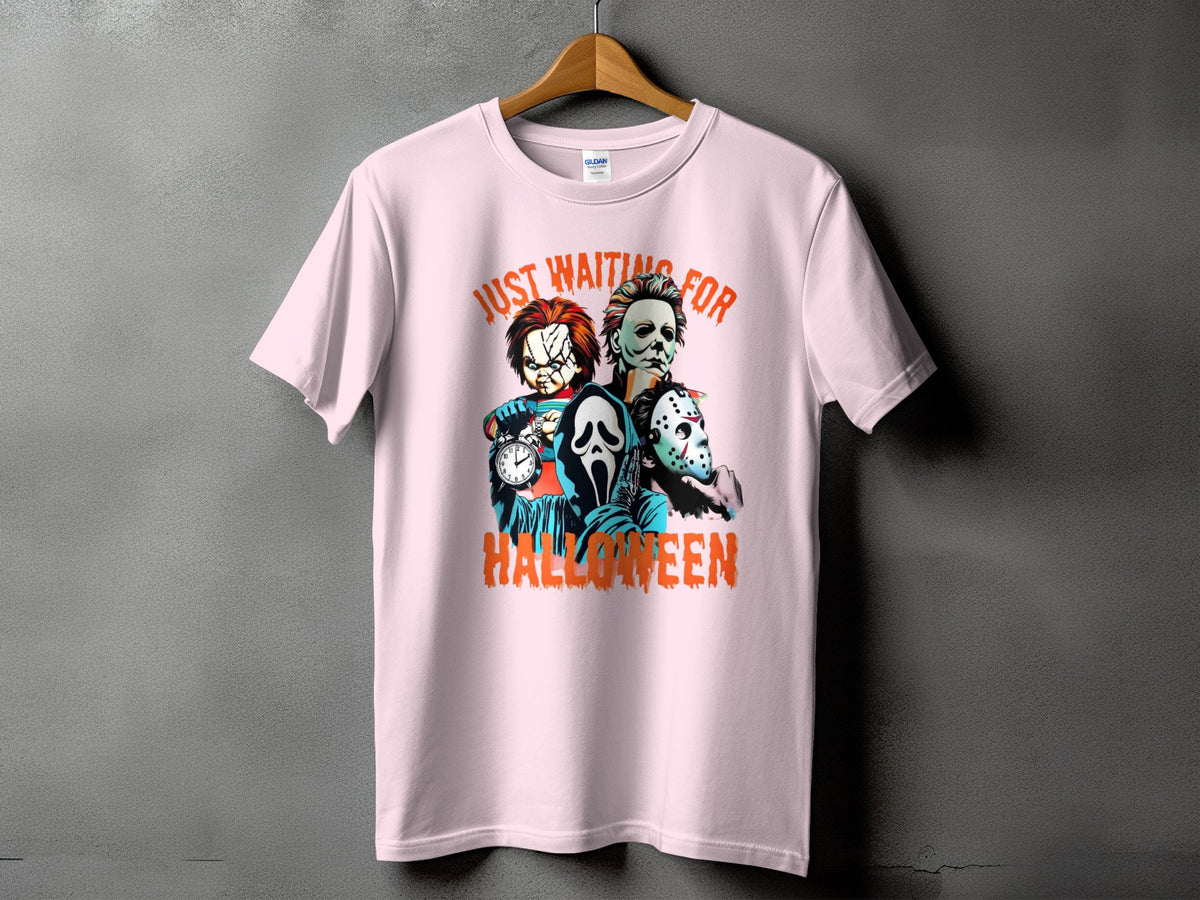 Pink t-shirt with horror characters Chucky, Michael Myers, Ghostface, and Jason Voorhees.