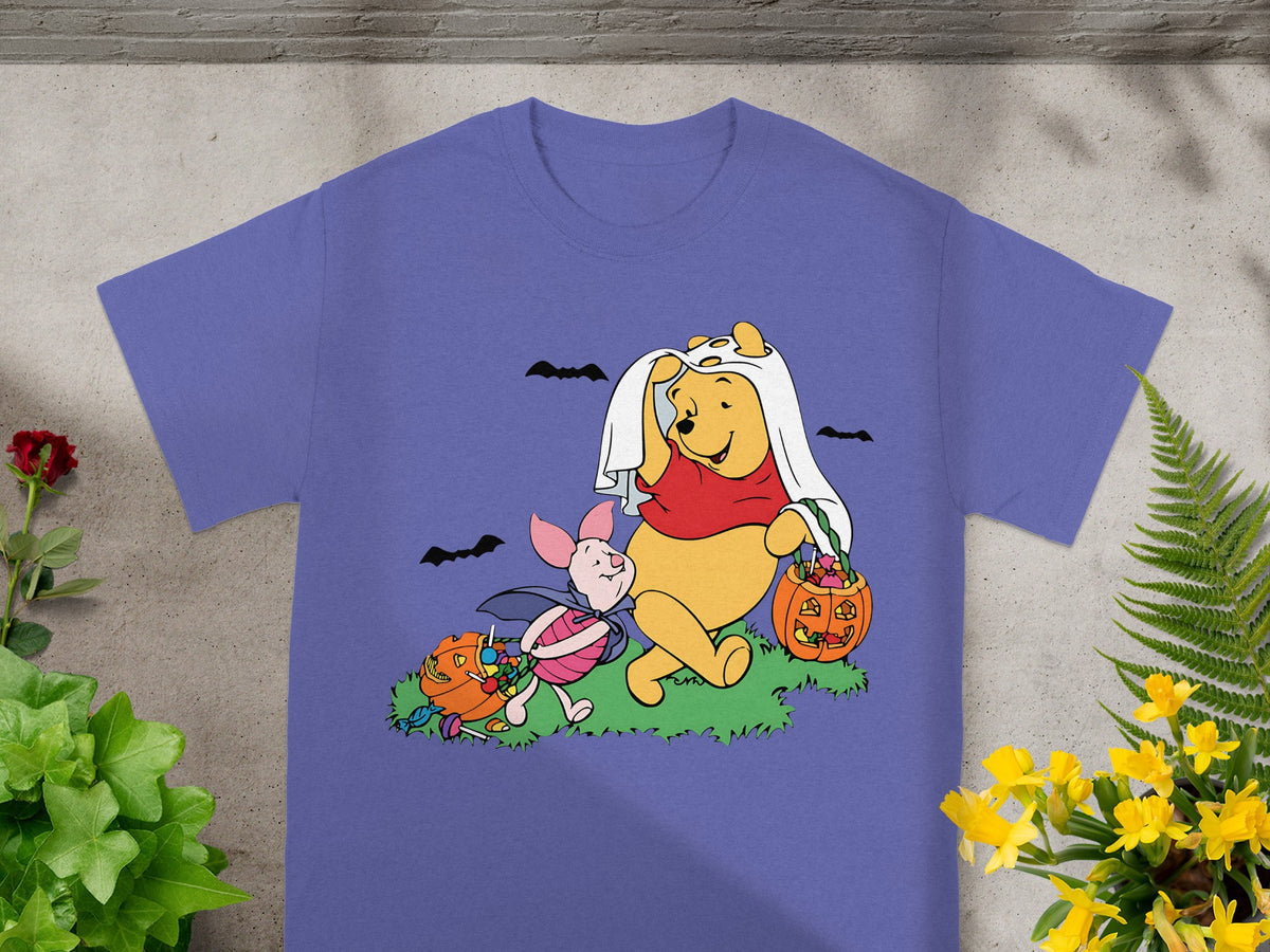Winnie the Pooh and Piglet in Halloween costumes with pumpkins and candy.