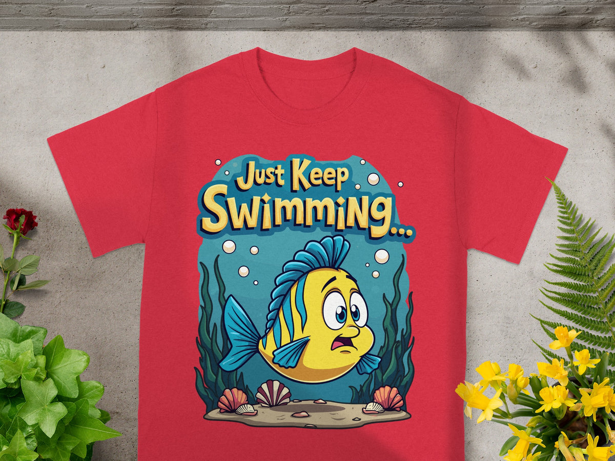 Yellow and blue fish with "Just Keep Swimming..." text on a red t-shirt.
