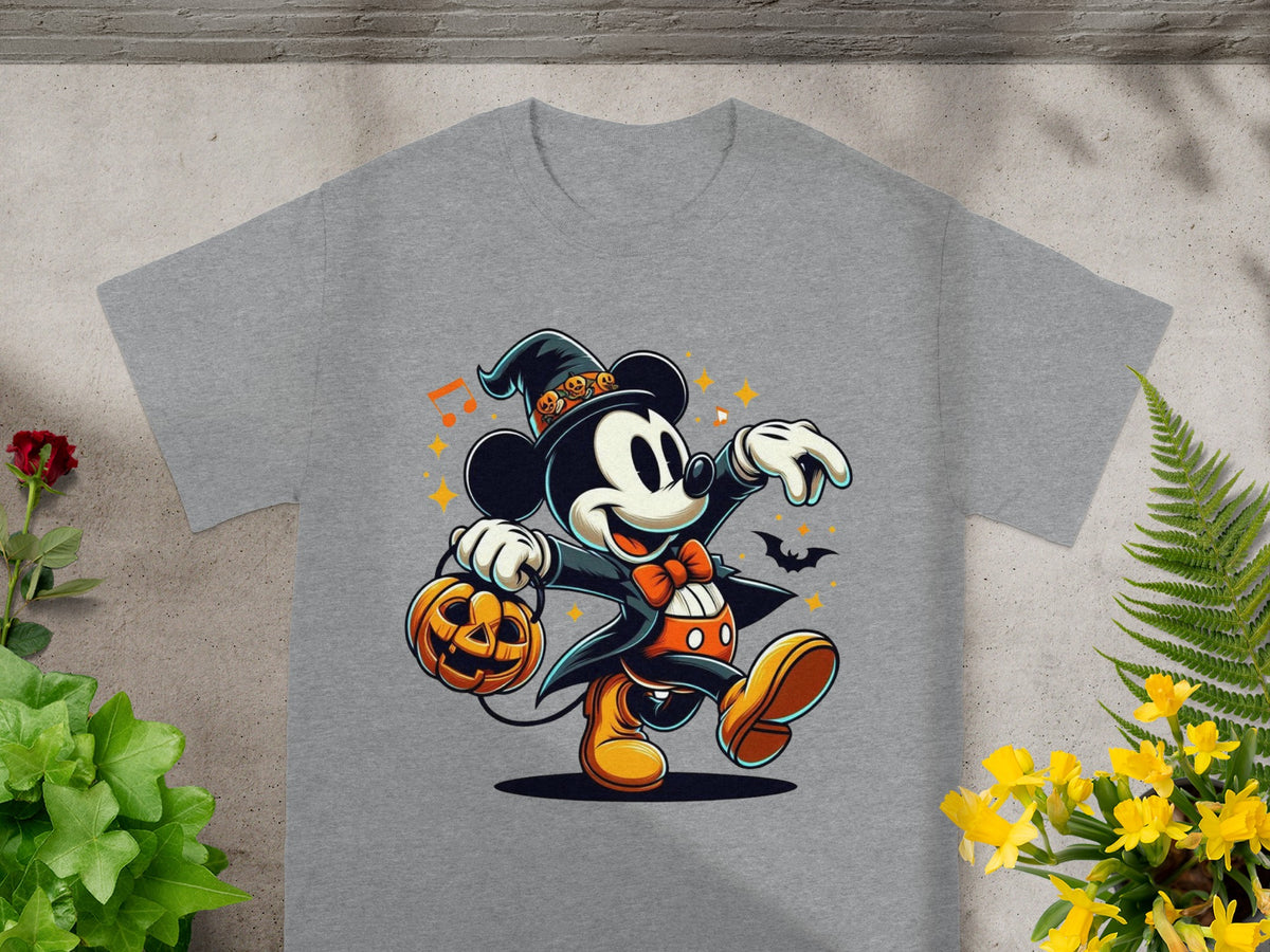 Mickey Mouse in a witch hat holds a jack-o'-lantern on a grey t-shirt.