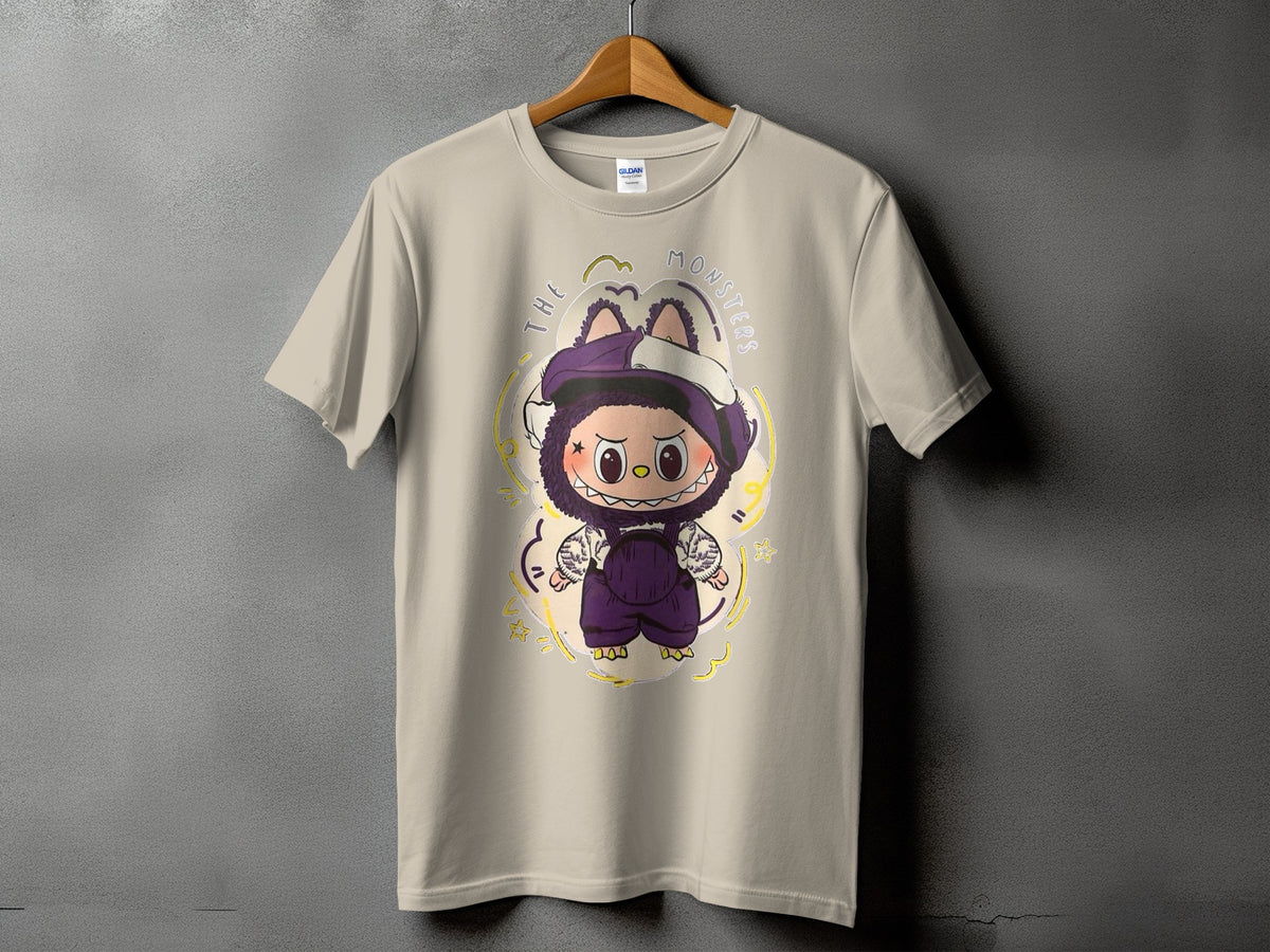 Tan t-shirt with a cartoon monster graphic and "THE MONSTERS" text.