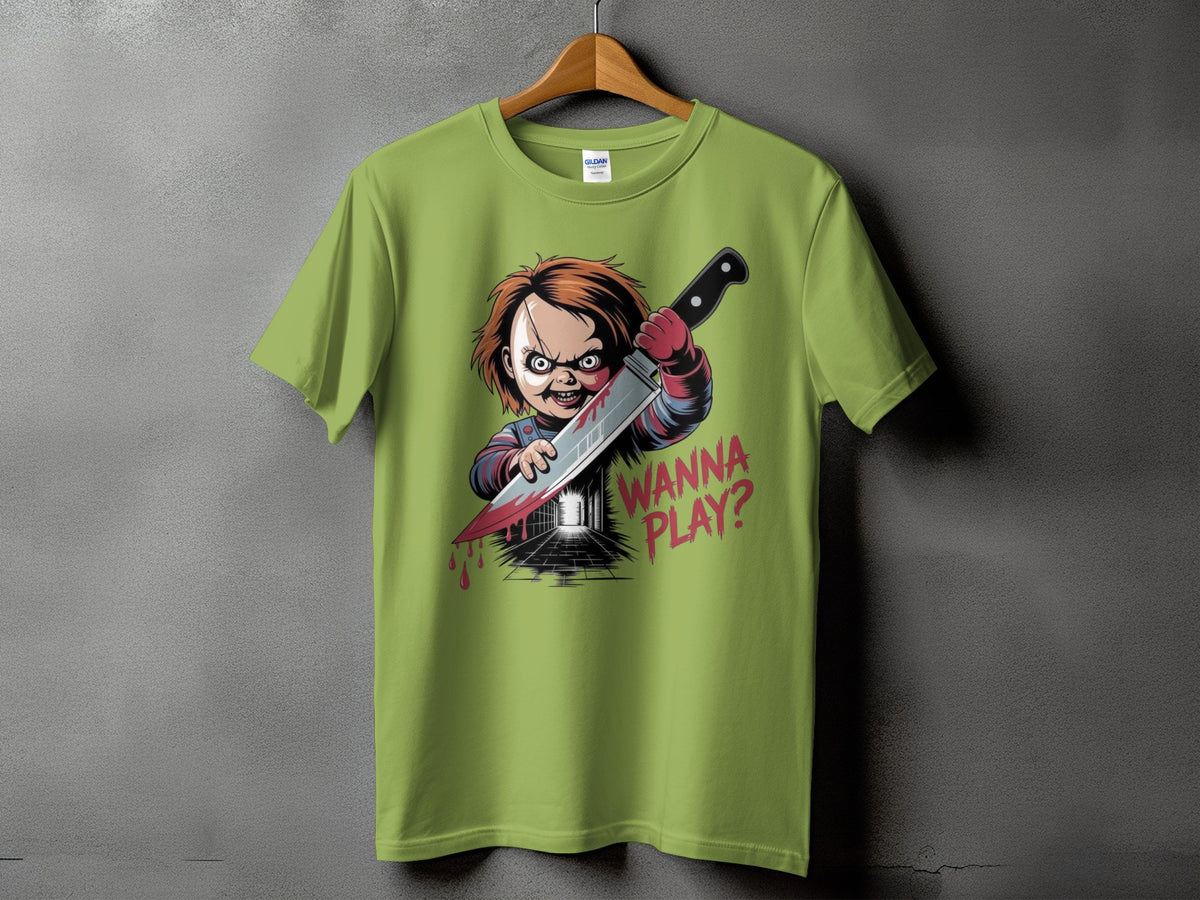 Chucky doll on a green t-shirt holding a bloody knife with "WANNA PLAY?" text.
